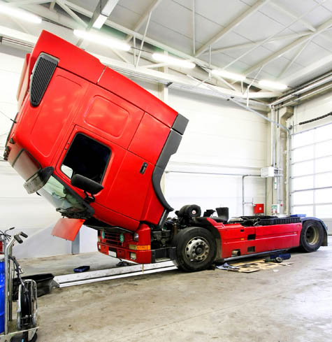 Red Commercial Truck Being Repaired Red Commercial Truck Being Repaired